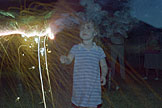 Sarah looking a little like lady liberty with her sparkler.