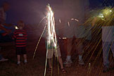 Todd and Joel get in the spirit with their sparklers and completely blocks themself from the camera.