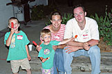 Todd, Seth, Laurie, and Chad enjoy a post fireworks popsicle.  Chad smirks about the quiteness of his boys.