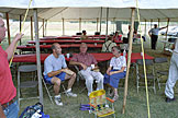 Cousin Jason Rassi makes sure the tent rope stays put while cousin Shannon Haerr, Uncle Ray Haerr, and Mom enjoy a little popcorn and conversation.