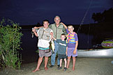 My Dad (uncle Bruce) takes some of his great nephews, Dallas and Parker, fishing.  Joel gets in on the picture.