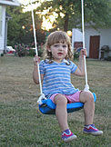 Sarah having fun on the swing.