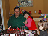 The birthday boy Alan and Madeline make a wish.