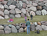 Madeline plays with Taylor, and Sarah, Joel and Craig throw around the football.