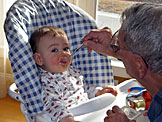 Grandpa feeds his Michael.