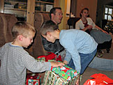 Seth and Todd get ready to rip into their presents.  Chad and Laurie can only imagine what the boxs contain.