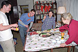 Makato, Joel, Iako, and Marie cook up some food.