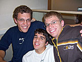 Jon, Kyle, and Jeremy pose at IHOP.  Kyle seems to be getting to short part of the bench.