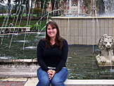 Erica posing at the fountain.  It looks like her head is leaking something.