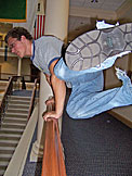 Jon jumps over the second floor railing.  You'll never know if he actually went all the way over.