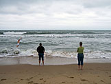 John dives in as Beth and Kyann look on.