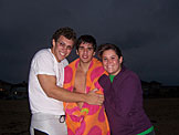 John, Kyle and Erica huddle to keep warm while it mists.