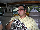 Derrick sports Kristi's sunglasses and blanket.
