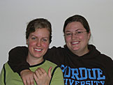Kyann and Beth smile because they just got kicked out of the kitchen.  What they don't know is that they are on for clean-up duty.