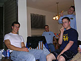 John, Eric Backstrom, Abe and Nick down some pizza and pop before the games.