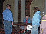 Abe and Katy wonder where the mean looking lady behind the Evangelism Seminar sign took Kristi.