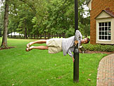 Dan is caught in a wind storm out in front of the Student Center.