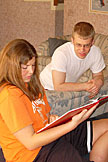 Kami and Jeremy reading a Marine's book.