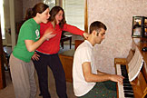 Erica and Kirsten acting amazed at Dan's mad piano playing skills.