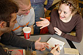 Dan and Kelby trying to teach Kristi how binary works.