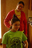 Erica shows that you don't need to practice cutting hair on dummys when you have your sister Kirsten.