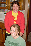 Erica smiling because Kristi cannot see behind her head to see what she did.