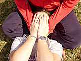 Kirsten hides her face from Erica and the camera