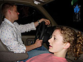 Jeremy stares off into the darkness fighting off sleep and cars getting in his way.  Kristi cannot look.