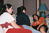 Erica, Kirsten and Kami share the sofa and conversation.