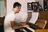 Dan plays the piano early in the morning.  The sleeping peoples wish he was busy shaving instead.