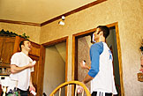 Mark and Dan juggle six pill bottles passing them back and forth.