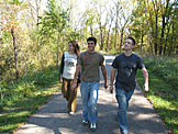 Kirsten, Kyle and Abe on a walk through Ironwood Park.