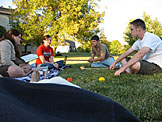 Erica, Kirsten, Kyle, and Abe relax after a hard game of croquet.