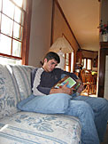 A comfy couch and a 'Get Fuzy' book is all Kyle needs to relax.