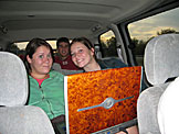Erica, Kyle, and Kirsten watching videos on the way home.