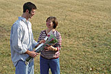 Dan gives April the roses from the guys.