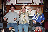 Warren, Abe, and Anna play Curses while the votes are tallied.
