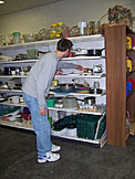 Dan tries to find a sippy cup for Kirsten.