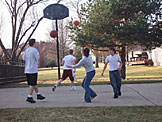 Michael, Jeremy, Katy, and Jon Peake play a little basketball.