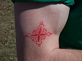 Mark's tat is deformed by his massive muscles.