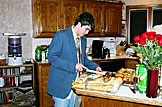 Kyle cuts the freshly baked bread.