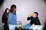 Dennis approves of the quality of Kirsten's gift.  Erica laughs away.