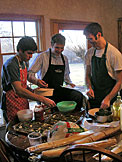 Kyle adds the meat, Mark adds the cheese, and Dan adds the spices.