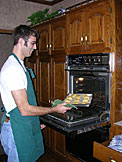 Dan pulls golden perfection out of the oven.