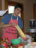 Kyle smiles and says, "look these noodles are cooked."