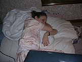 Kristi tries to sleep her pain away.