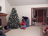 Kristi and Katy Schlipf checking out the little cars on the Reinhard Christmas tree.