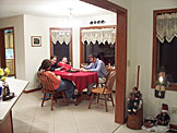 Gale Reinhard, Katy, Kristi, and Dan have a good time waiting for people to arrive.