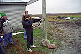 Leo and Abe wonder what Kristi is listening to on her headphones while she shoots.  I think she likes firearms a little too much.