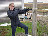 Kristi with a gun, a smile.  There's no wonder why the guys cleared out.